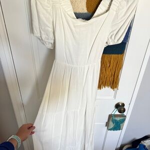 White dress. New with tags. Medium. Puff sleeve and open back with bow